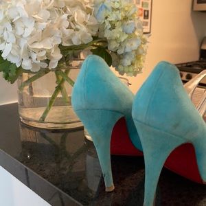 Worn-in Christian Louboutin pumps